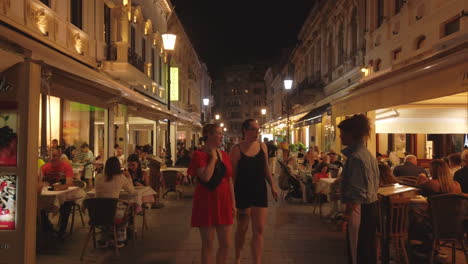 Old-town-streets-with-tourists-at-night,-Bucharest,-Romania