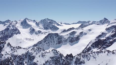 Beautiful-cinematic-aerial-of-snowy-alpine-mountain-glacier-peaks