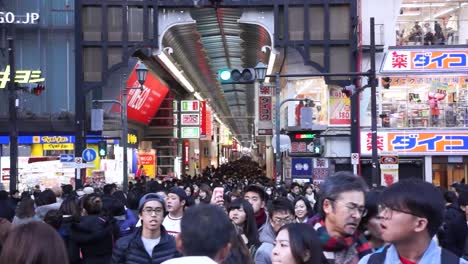 Slow-Motion-Shot-Of-Crowd-Walking-in-Dotombori,-Osaka,-Japan