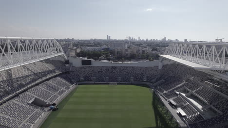 Raw-file---Flying-over-the-empty-Bloomfield-football-Stadium-amazing-engineering-and-finest-grass-Jaffa-Tel-Aviv,-the-Stadium-renovated-for-3-years-and-It-is-the-home-of-three-clubs