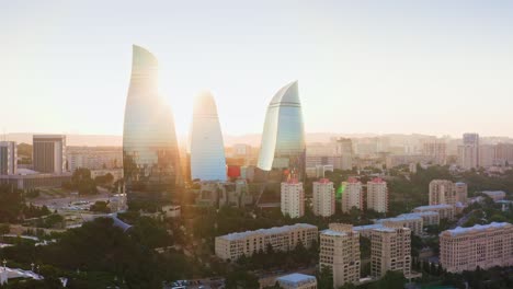 Aerial-view-of-Flame-Towers-at-sunset,-Baku,-Azerbaijan