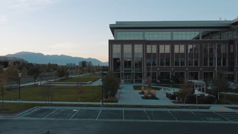 FamilySearch-building-entrance-in-Lehi,-Utah---push-in-aerial