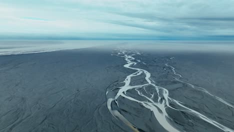 Aerial-View-Of-Glacial-River-In-Southern-Iceland---drone-shot