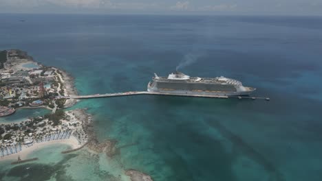 Large-Caribbean-cruise-ship-at-pier-of-Little-Stirrup-Cay-in-Bahamas