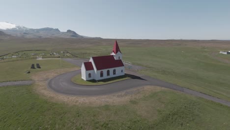Parallax-view,-around-historic-Ingjaldshóll-church,-west-Iceland