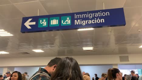 Lots-of-people-waiting-at-Immigration-in-Cozumel,-Mexico