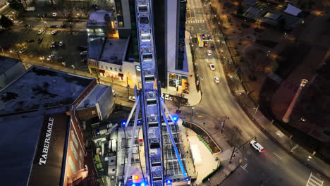 Aerial-flight-approaching-Skyview-Atlanta-and-Tabernacle-concert-hall-in-Atlanta-during-night