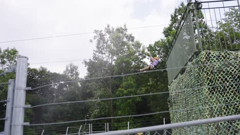 Man-Ziplines-Through-Giant-Godzilla-Mouth-at-Nijigen-No-Mori