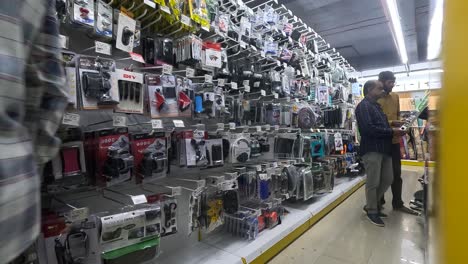 POV-shot,-people-shopping-for-car-related-accessories-in-shopping-mall