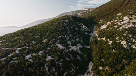 Drone-ascends-above-blue-lagoon-Cres-Island-Croatia-at-golden-hour