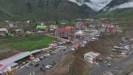 A-beautiful-scenic-drone-view-of-a-small-town-in-KPK-province,-Pakistan---Batakundi-Naran-aerial-drone-view-with-hotels-and-markets