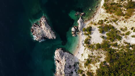 Bird's-eye-view-top-down-static-of-rugged-shoreline-of-Lubenice-beach,-Croatia