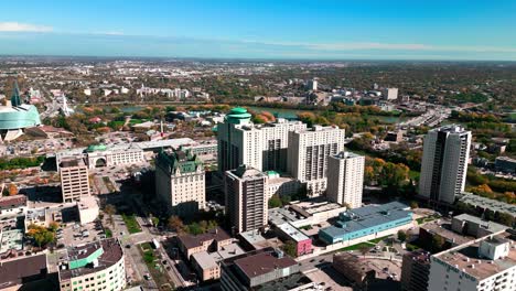 Twisting-Beautiful-Orbit-Daytime-Landscape-Drone-Footage-of-The-Fort-Garry-Hotel-Historic-Landmark-in-Downtown-Urban-Canadian-City-Spinning-Restaurant-Tourist-Attraction-Winnipeg-Manitoba-Canada