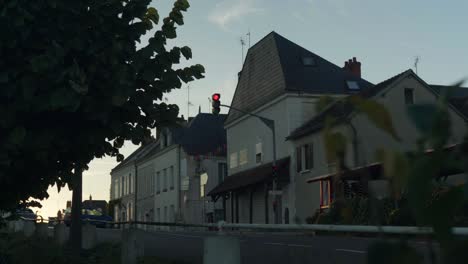 Vehicles-travelling-through-a-small-French-village-on-a-lovely-Summer’s-evening