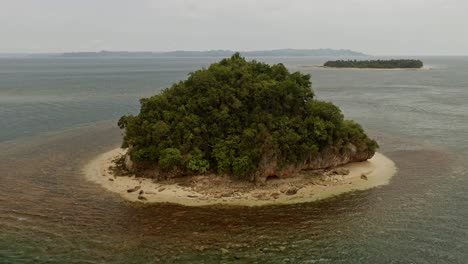 Aerial-Orbital-View-Around-Malingin-Island-with-Scenic-Background-Views-of-the-Philippines