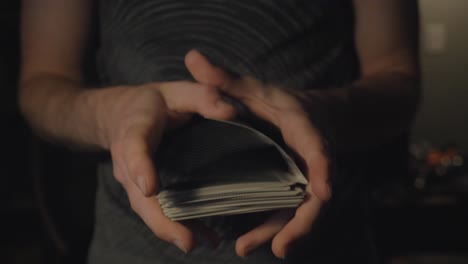 A-slow-motion-push-in-of-a-deck-of-cards-being-shuffled-in-slow-motion