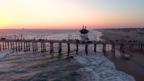 Beautiful-HB-Pier-Silhouette-At-Sunset-Golden-Hour-with-golden-Skies-and-Golden-Water