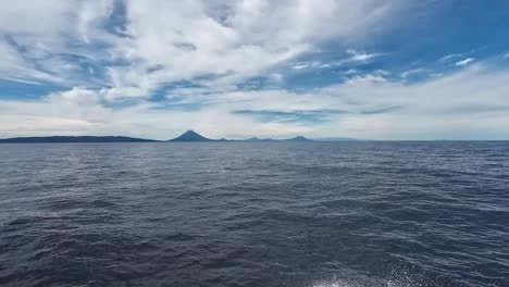 Bola-Volcano,-West-New-Britain,-Papua-New-Guinea-seen-from-boat-on-ocean