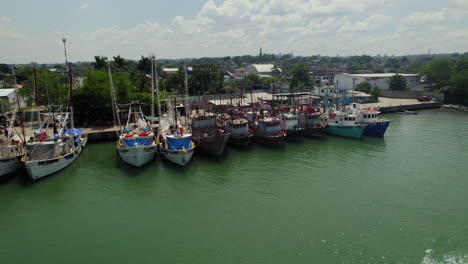 Docked-fishing-boats-in-a-tropical-river