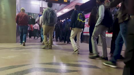 metro-station-view-with-metro-arriving-and-passenger-walking-from-different-angle-video-is-taken-at-janakpuri-west-delhi-india-Jan-04-2023