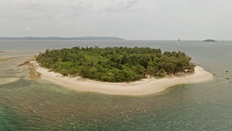 An-aerial-drone-shot-of-Alingkakajaw-Island---Claver,-Surigao-Del-Norte,-Philippines