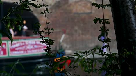 People-walking-past-Canal-Boats,-London,-United-Kingdom