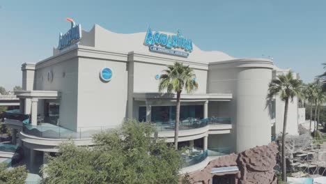 An-aerial-establishing-shot-of-The-Downtown-Aquarium-under-blue-skies-in-downtown-Houston-Texas