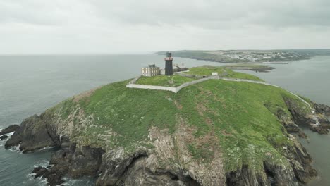 Charming-View-of-the-Ballycotton-Lighthouse-on-the-Cliffs,-County-Cork,-Ireland---Aerial