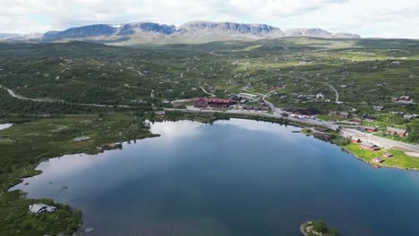 Geilo-Norway---Ustedalsfjorden-Lake,-Small-Mountain-Village-and-Winter-Sport-Ski-Area-during-summer-in-Viken---Aerial