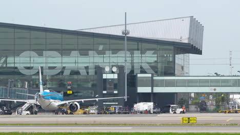 Rear-Of-Passenger-Aircraft-Parked-At-The-Apron-Of-Gdansk-Airport-In-Poland