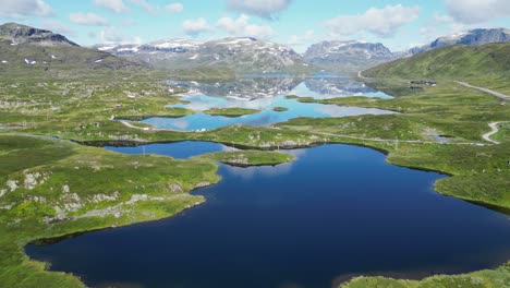 Scenic-Nature-in-Norway---Stavatn-Lake-and-Snow-Covered-Mountains-Peaks---Vestland,-Vestfold-og-Telemark---Aerial