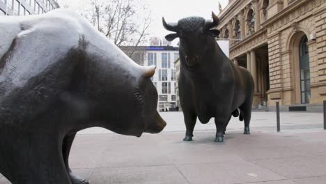 Steel-bull-and-bear-outside-stock-market-office-in-Germany,-concept-of-shares