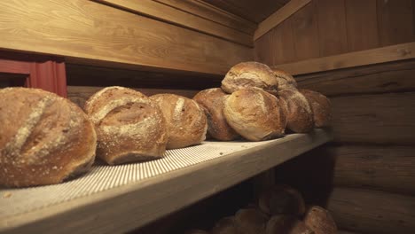 Fresh-Breads-On-The-Wooden-Rack-Inside-The-Mjonoy-Bakeri-In-Vinje,-Telemark