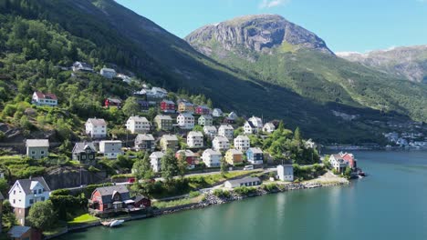 Odda-Village-at-Hardanger-Fjord-in-Vestland,-Norway,-Scandinavia---Aerial-Circling