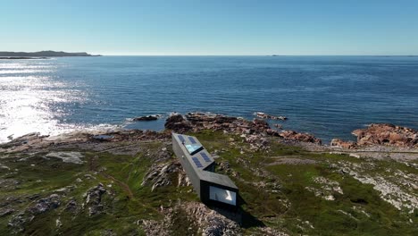 Joe-Batt's-Point-Trail-Overlooking-Long-Studio-Modern-Architecture-on-Fogo-Island-from-an-Aerial-Orbital-Drone-Shot,-Newfoundland,-Canada
