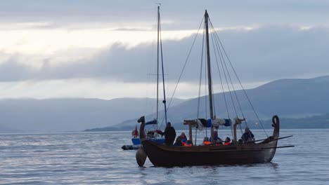 People-on-small-boat-at-the-Viking-Festival-in-Largs,-North-Ayrshire
