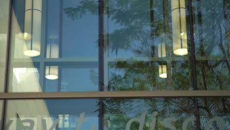 Close-up-of-a-glass-window-pane-at-Whitby-Public-Library-in-Canada,-captured-with-a-slow-panning-shot