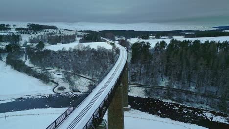 Fly-along-and-under-amazing-historic-structure-of-Findhorn-Viaduct