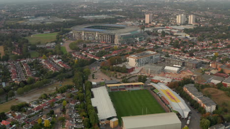 Dolly-back-aerial-shot-over-Twickenham-stadium-and-stoop