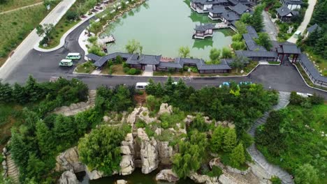 Aerial-tour-of-China-traditional-buildings,-lakes-and-mountains