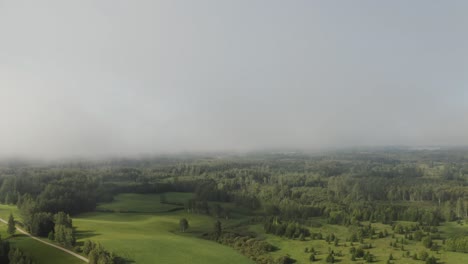 Descending-out-of-the-clouds.-Countryside-Aerial