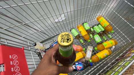 POV-shoot,-people-are-buying-groceries-and-beer-for-a-house-party-and-putting-billing-in-a-shopping-basket