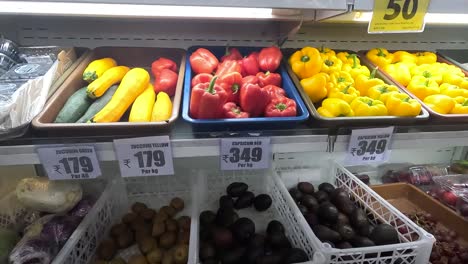 POV-shoot,-woman-buying-red-and-yellow-capsicum-from-vegetables-market-in-super-market