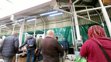 POV-looking-around-British-flea-market-at-variety-of-junk-and-unwanted-objects-for-a-cheap-bargain