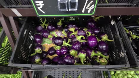 POV-shot,-woman-buying-face-eggplant-vegetables-from-super-market