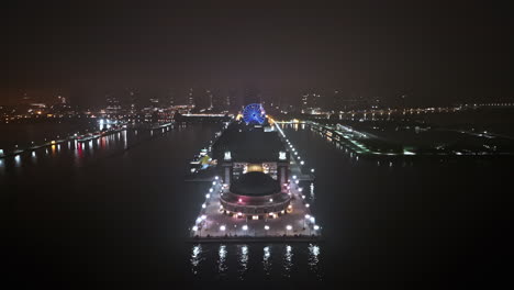Aerial-view-over-the-illuminated-Navy-pier,-quiet,-misty-night-in-Chicago,-USA