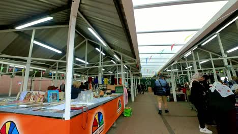 POV-looking-around-British-street-market-at-variety-of-disposable-unwanted-objects-for-a-cheap-bargain