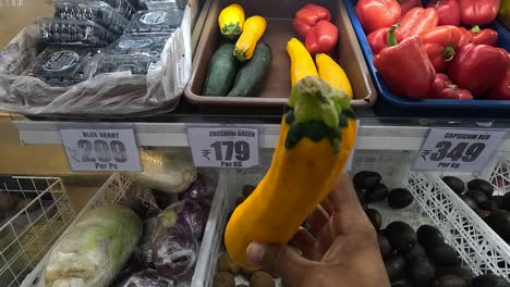 POV-shoot,-woman-buying-red-zucchini-zucchini-yellow-from-vegetable-market-in-super-market
