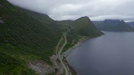Flying-over-the-mountain-road-towards-the-old-Fishing-village-Husoy-on-Senja-Island