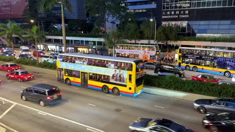 Busy-Traffic,-Taxis-and-Double-Decker-Buses-Driving-in-Hong-Kong-During-Rush-Hour